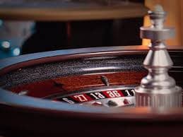 Phoenix Rises slot interface on rtp batik77 showing five-reel layout and bet controls